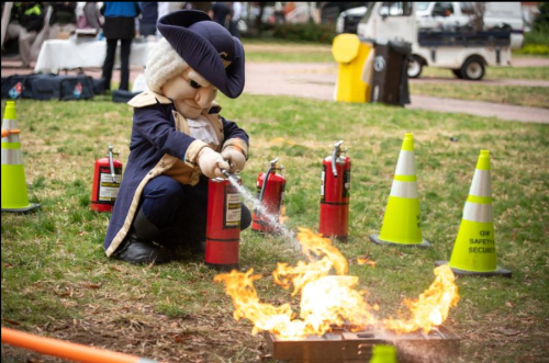 GW Mascot 'George' using a fire extinguisher
